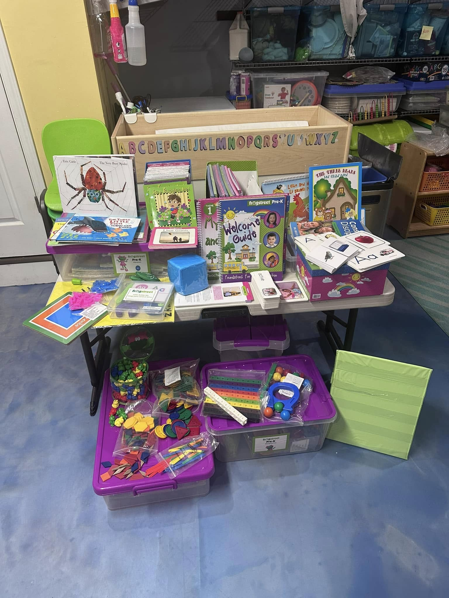 Shelf of educational materials, books, and learning supplies